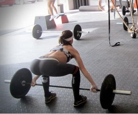 woman performing deadlift exercise