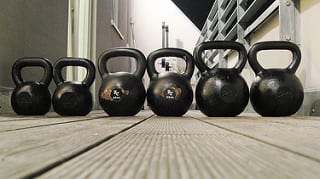 Kettlebells lined up on a deck icon https://get-strong.fit/Fitness